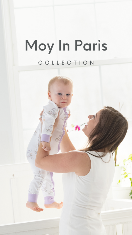 A mom pampering her baby who wears "Moy In Paris" organic baby cloth collection.